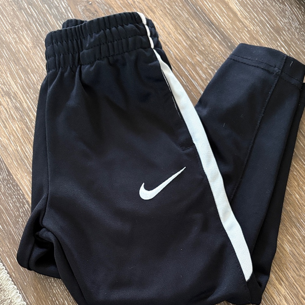 Nike Kids Black Joggers with White Stripe